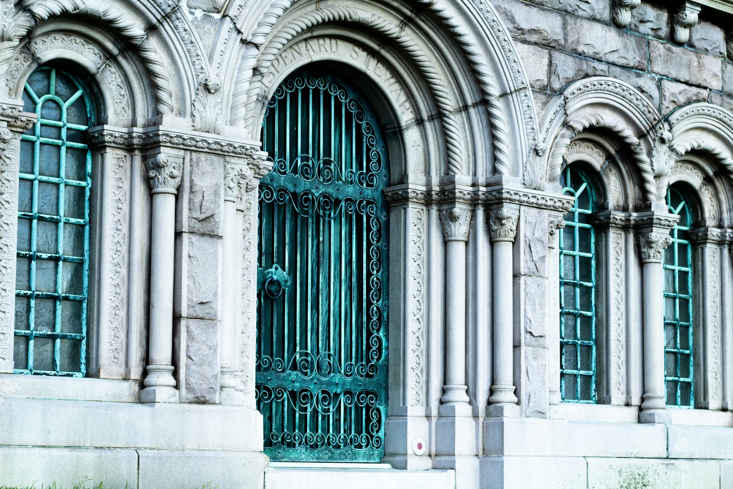 the doors of the building are open with bars