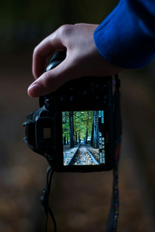 a man is holding a video camera out for the people