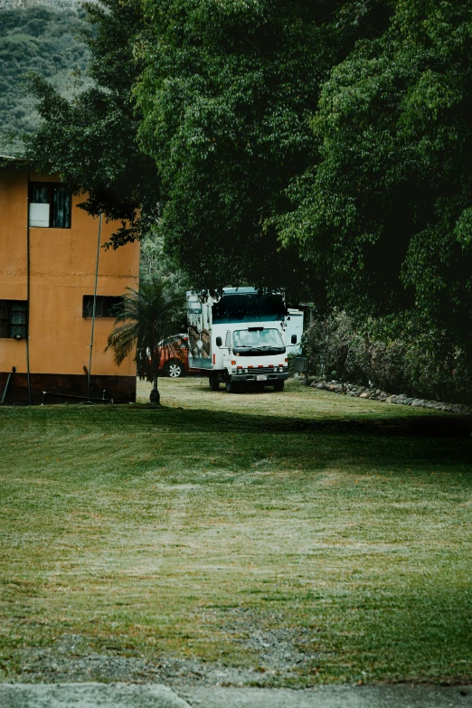 a big truck is parked on the side of a building