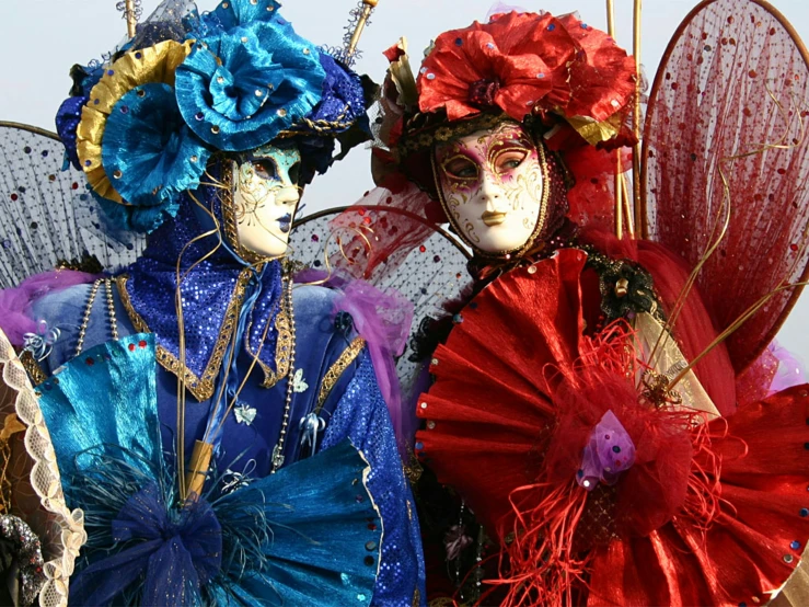 three women's face - sculptured outfits with fans and beads