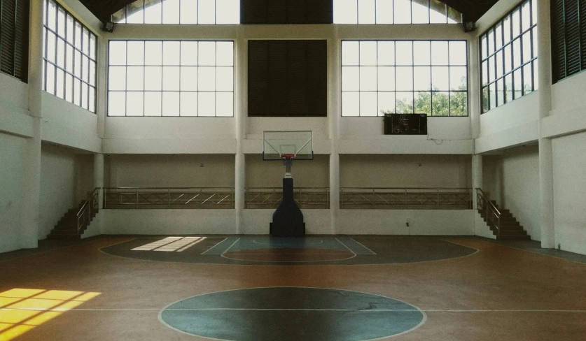 a room with windows and a basketball court