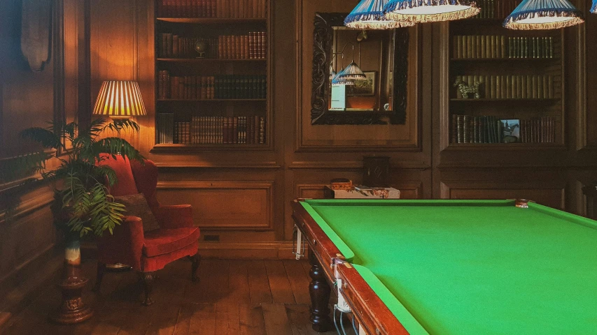 an open billiard table inside of a wooden building