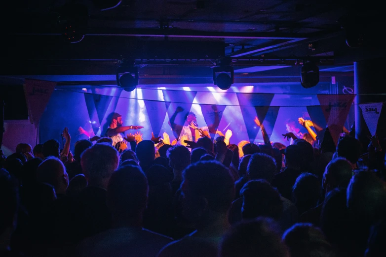 an open auditorium filled with people on stage