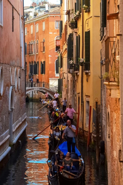 several small boats are lined up along the canals