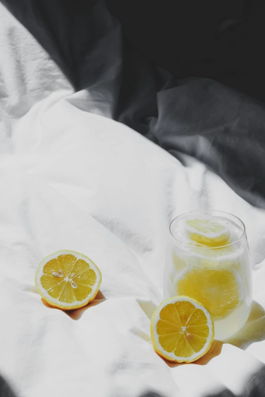 two orange slices sitting on top of a white cloth