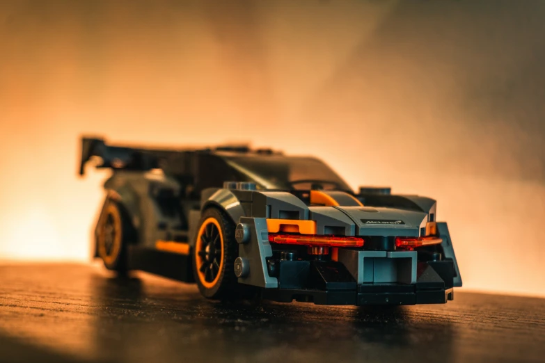 a model of a car with orange rims