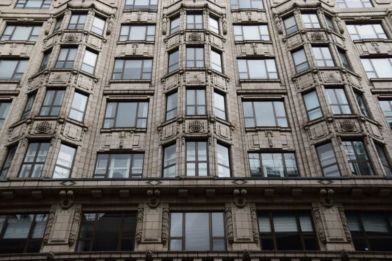 a tall building with lots of windows next to it