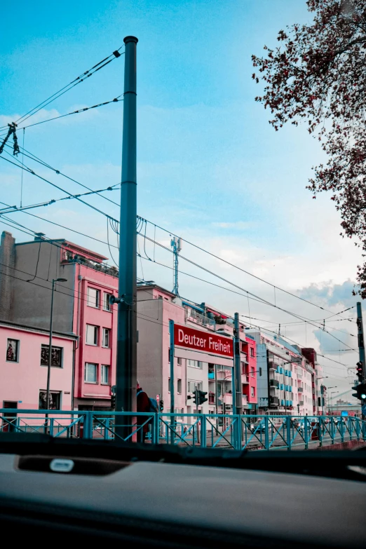 the blue wire across from a large pink building