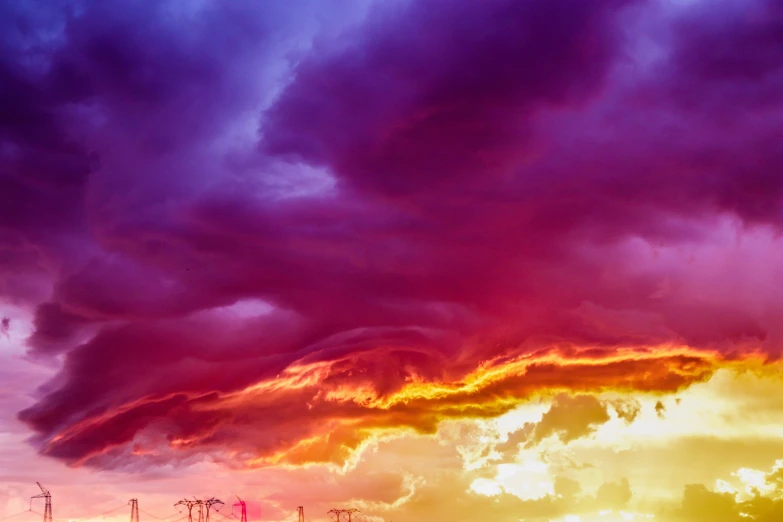 colorful sky with many clouds and power lines