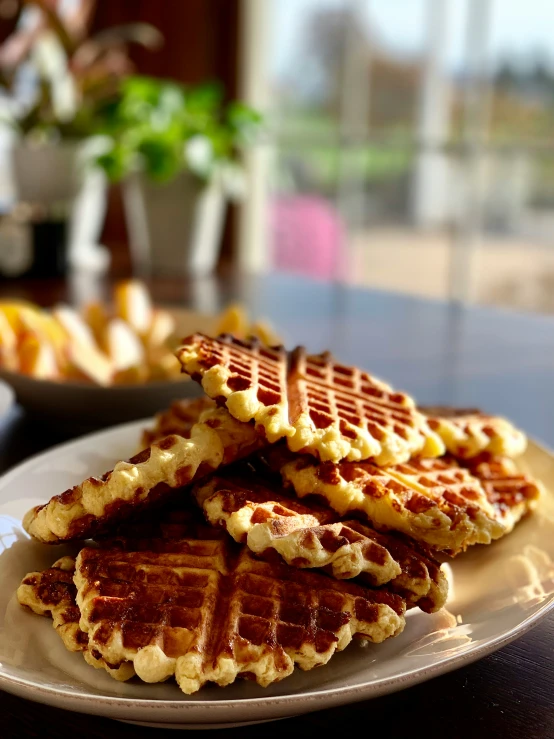 three pieces of waffles stacked on top of each other on a plate