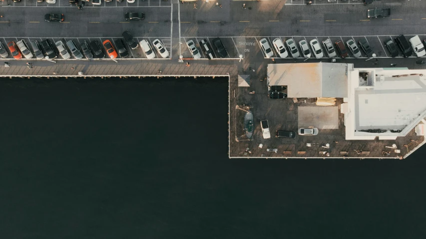 a po taken from above of a parking lot on a dock