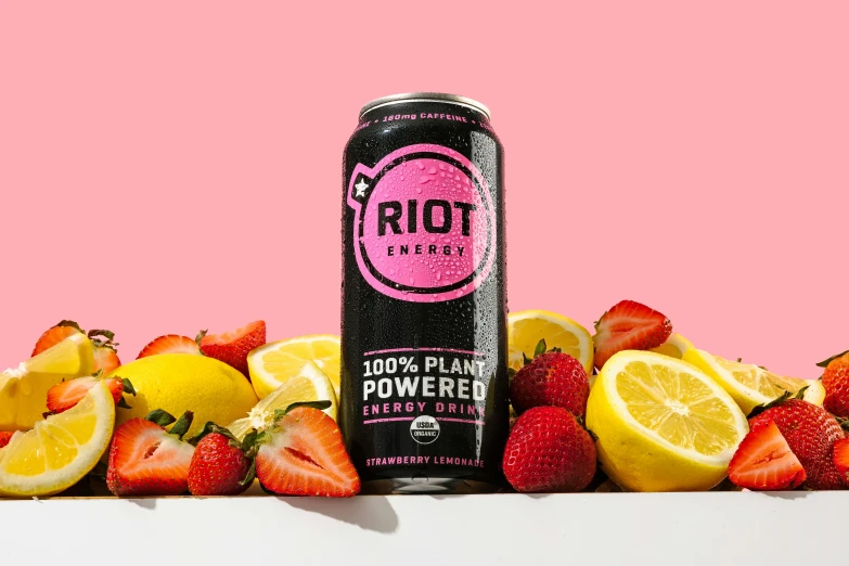 the can of riot next to some sliced up strawberries