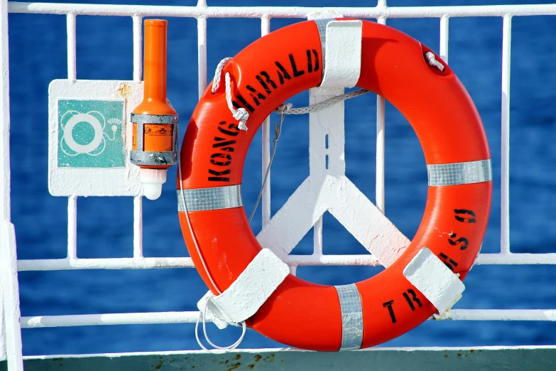 a life preserver and an orange tube on a boat