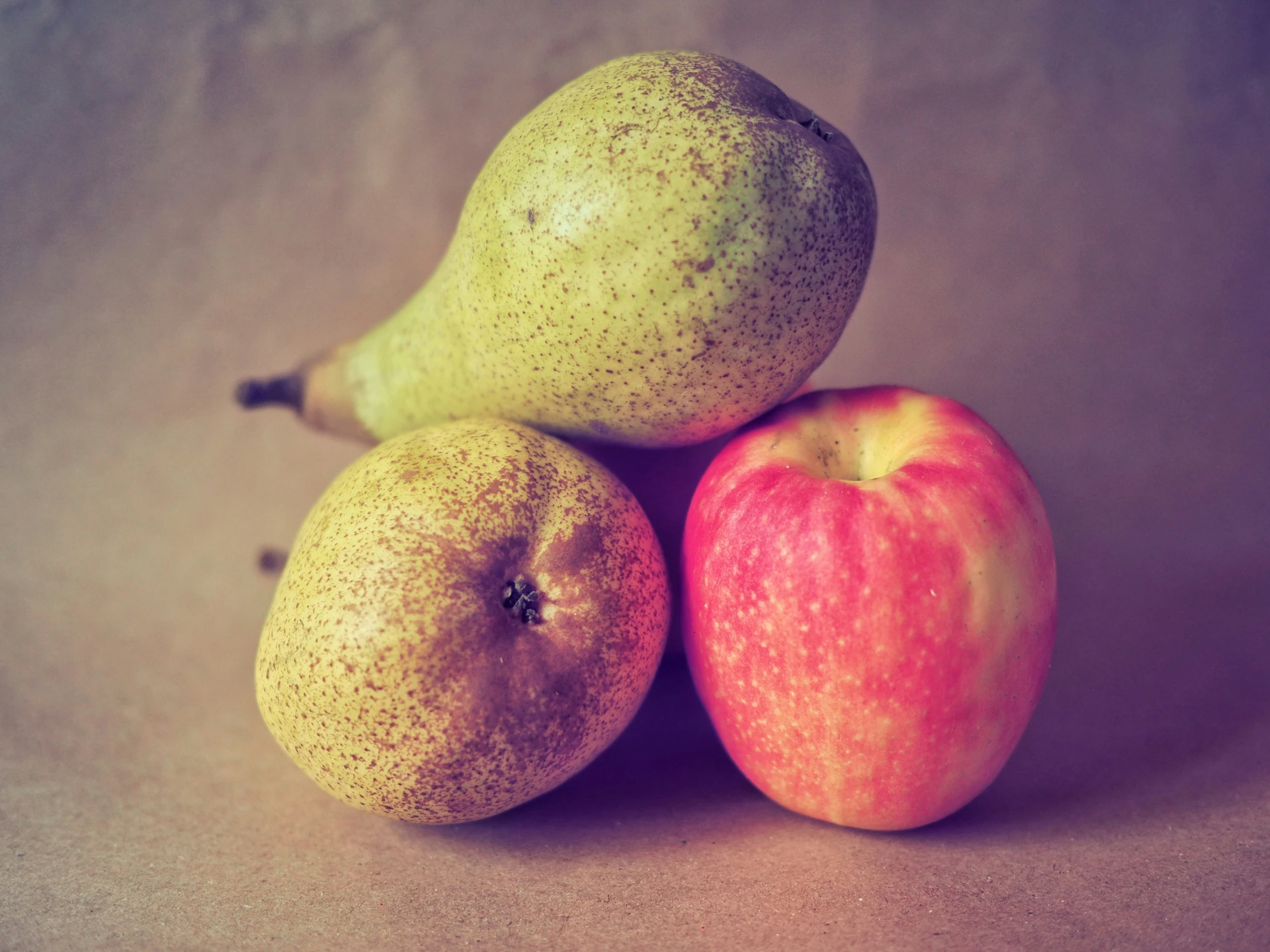 three pieces of fruit sit on top of each other