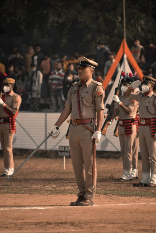 a group of soldiers stand with swords in their hands