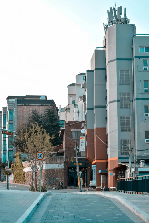 an urban area with several buildings and cars