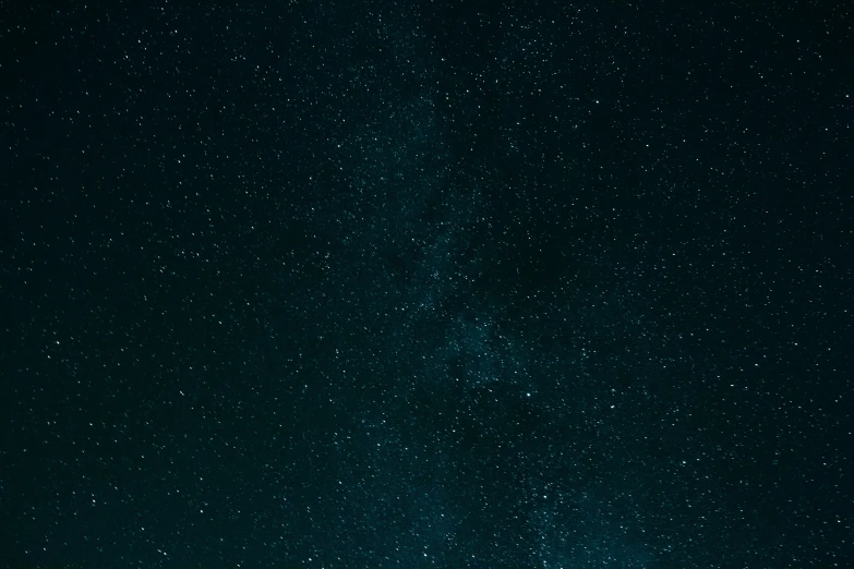 night sky with stars and white dots in foreground