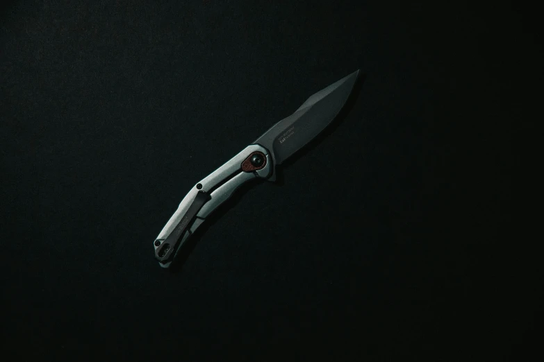 a small knife on a dark background