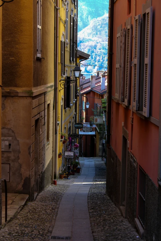 an narrow alley way is full of many buildings