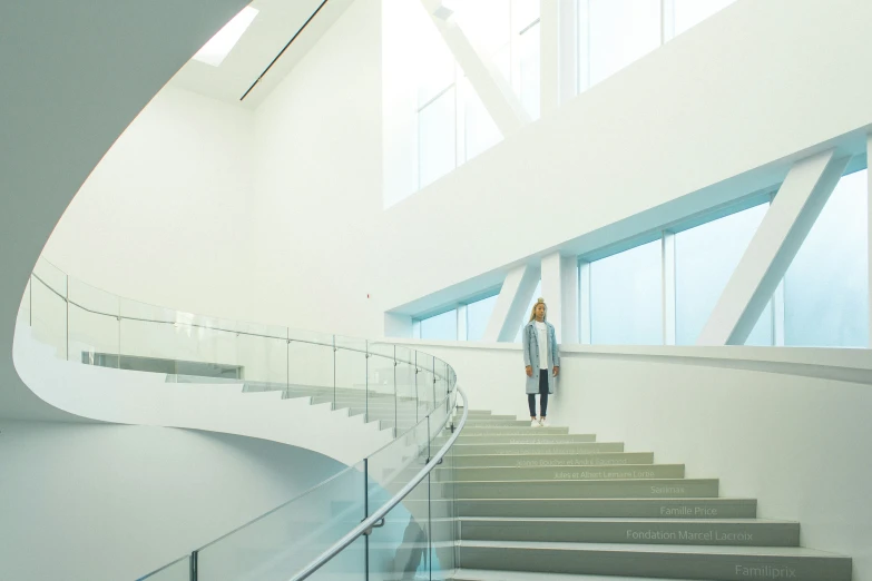 a girl standing on a staircase with her feet up