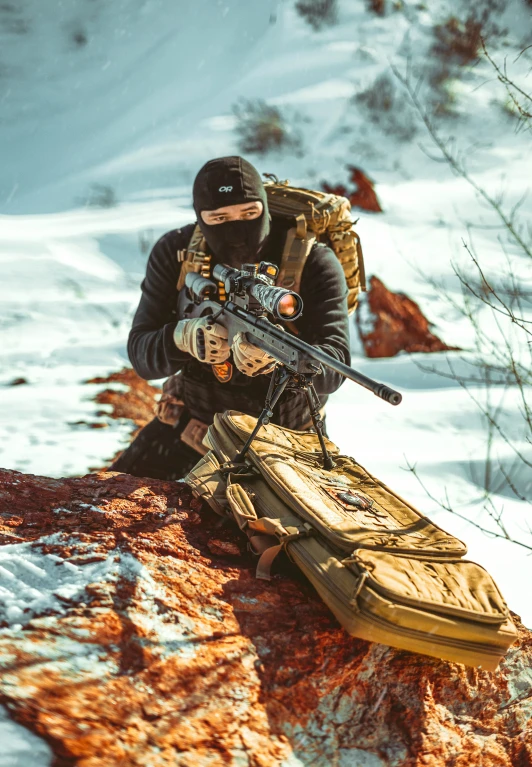 a person in the snow sitting on a mountain