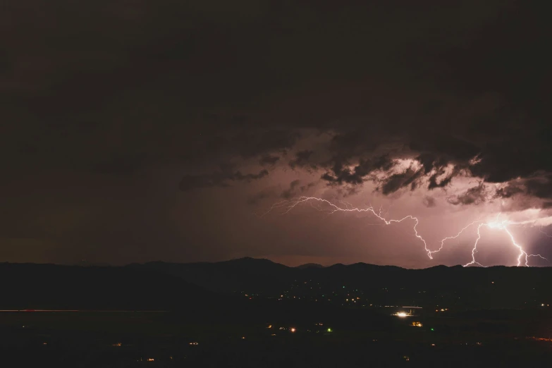 a very big night sky with some clouds and lights