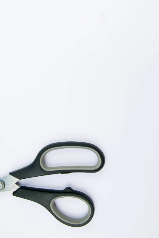 two black scissors on a white background with black handles