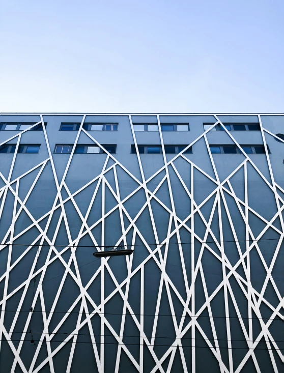 architectural pograph of white lines on a blue building