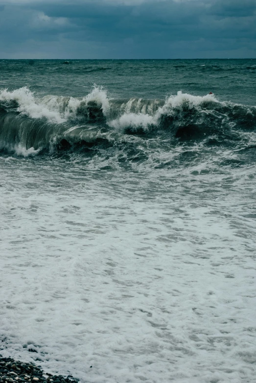 there is a person riding a surf board on a wave