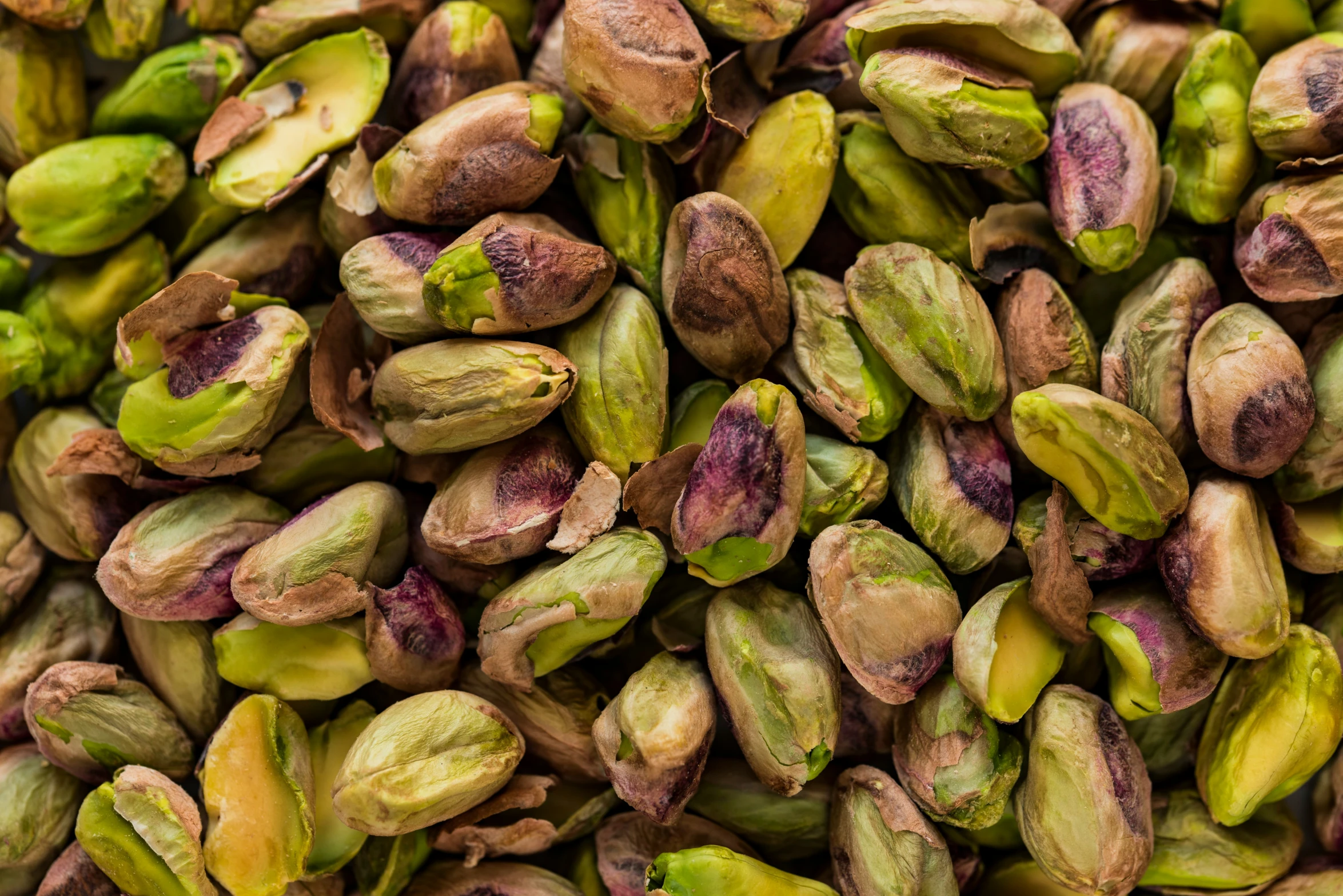 nuts are displayed in the center of a pile