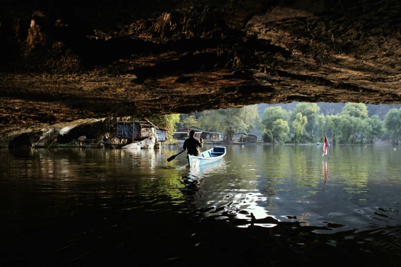 a man is floating in his small boat