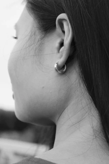 an image of a woman with a ear piercing