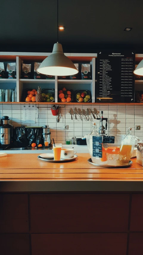 the counter top has oranges, lemons and some coffee