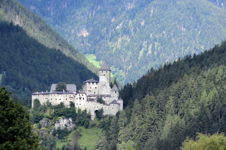 an old castle perched on top of a hill