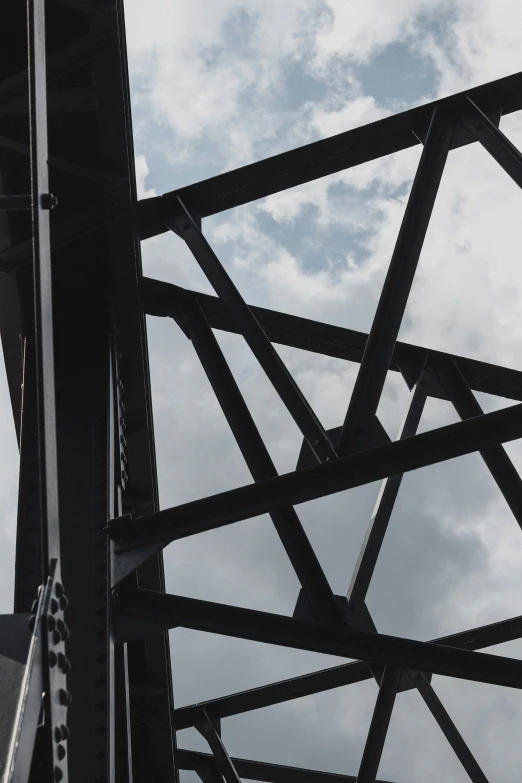 the image shows the sky and clouds over a bridge