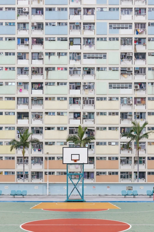 there is a basketball court outside of a building