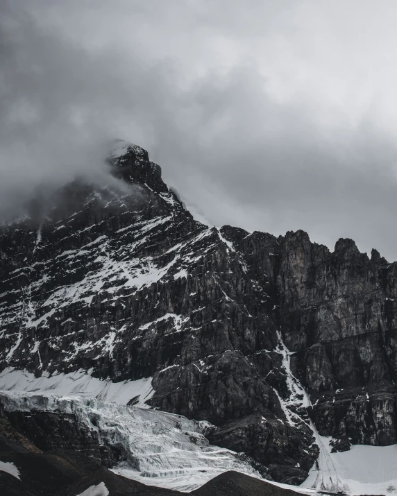 some big rocks in a snowy mountain side