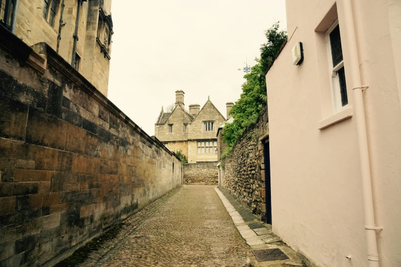 the alley way is lined with stone buildings