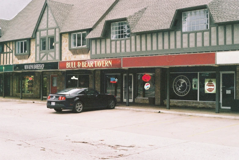 a car is parked in front of the building