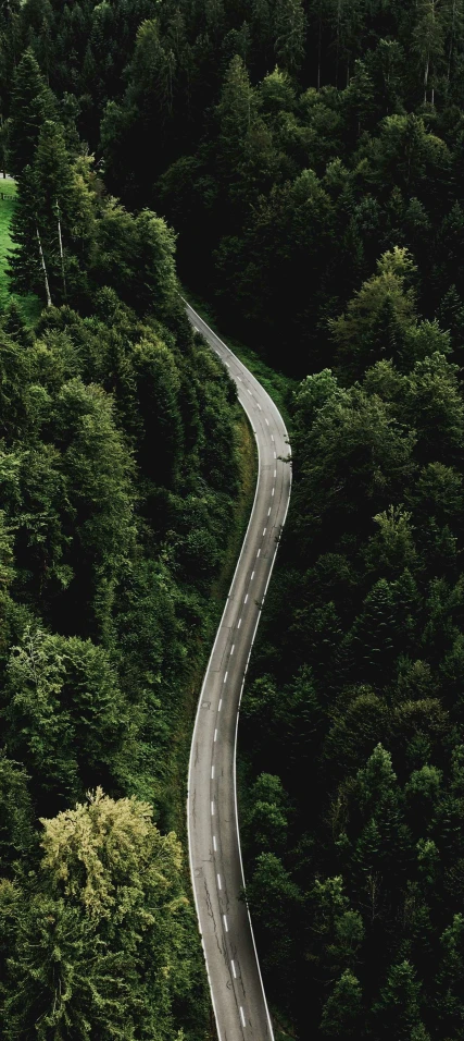 a truck drives down a long straight road