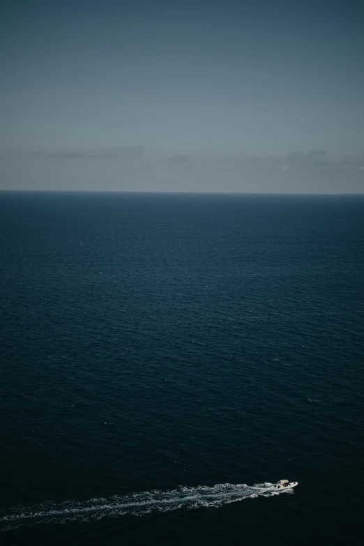 a small boat on the open water