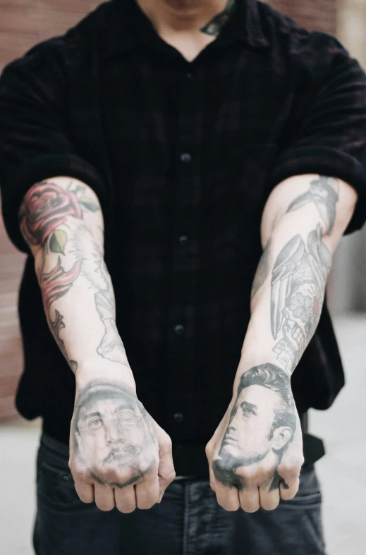 tattooed arms and legs holding onto each other
