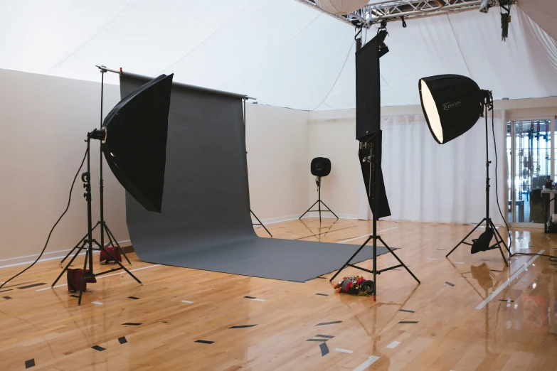 lighting equipment and lighting props on display in an empty room