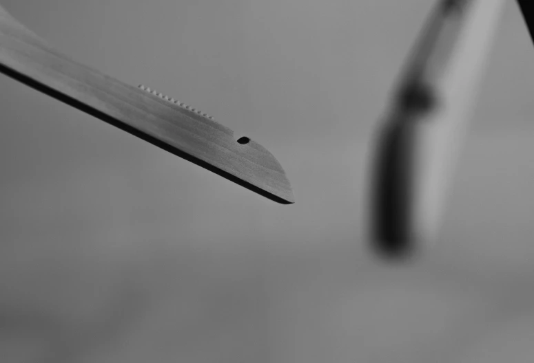 closeup s of a knife with a blurred background