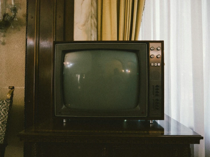 a tv sits in the corner of a room