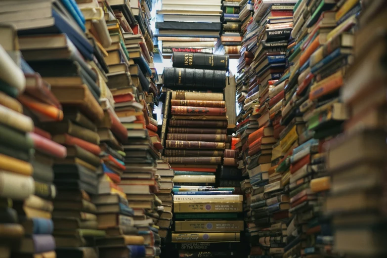 a narrow room filled with lots of books
