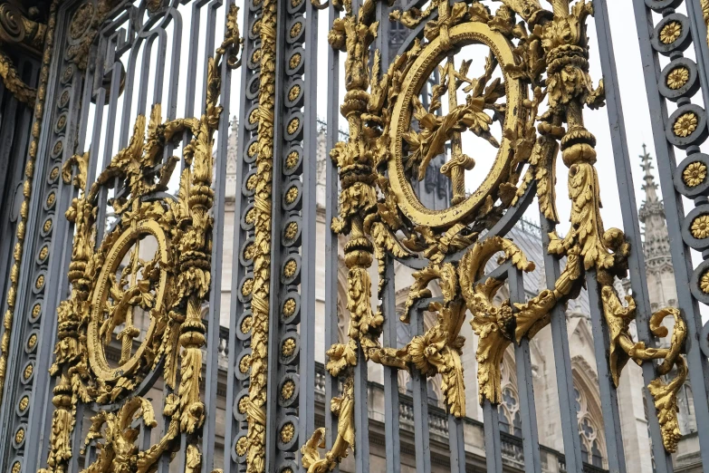 intricately designed iron fences are featured in the background