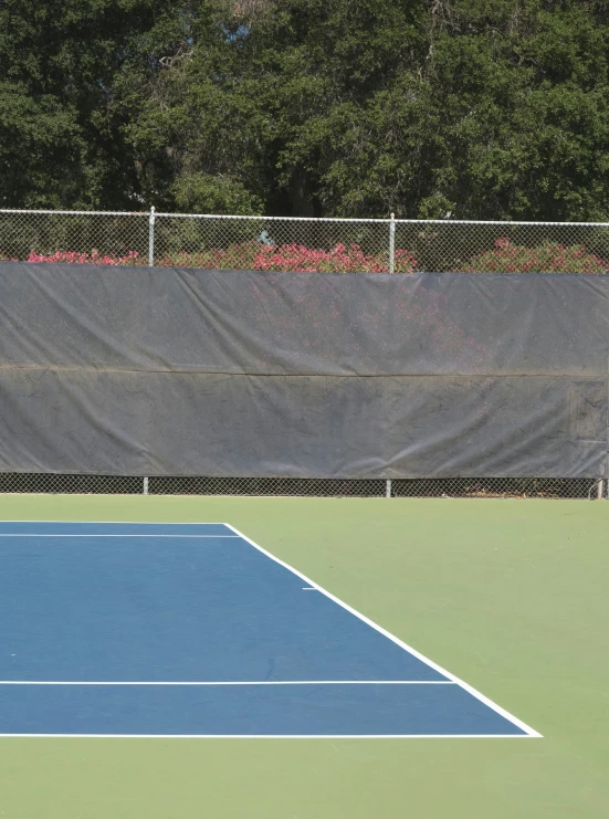 a man standing on a tennis court with a racquet