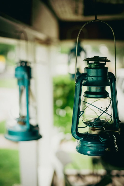 two hanging teapot lights with one light turned on