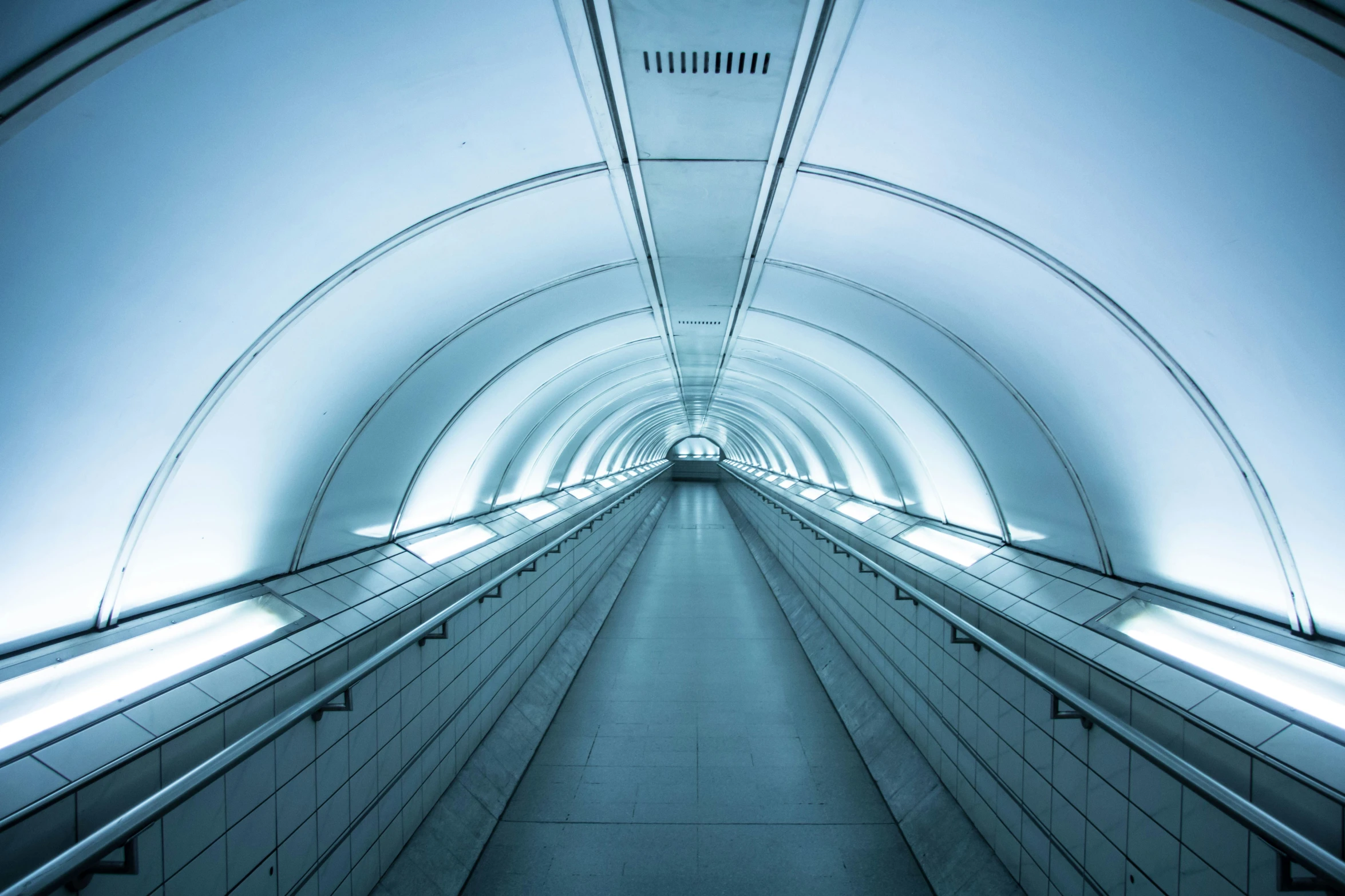 an empty walkway in a large building